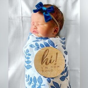 SpearmintLOVE muslin swaddle blanket. White and royal blue floral pattern.
